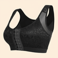 Brassière grand maintien femme noire avec fermeture à agrafes sur le devant, dentelle florale et bretelles larges, packshot e-commerce sur fond ivoire crème.