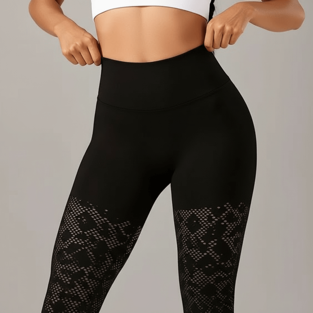 zoom sur la taille haute lisse du legging de compression noir avec zones texturées